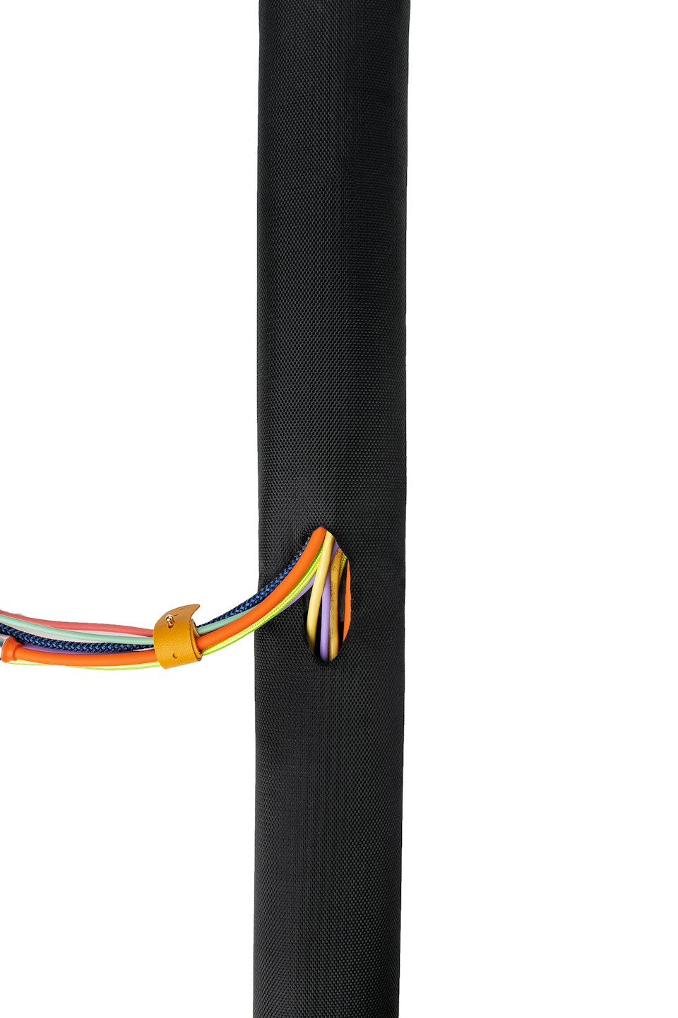 Colorful braided cables organized inside a black cable management tube.